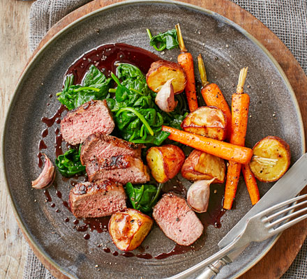 Loin of lamb, wilted spinach, carrots & rosemary potatoes