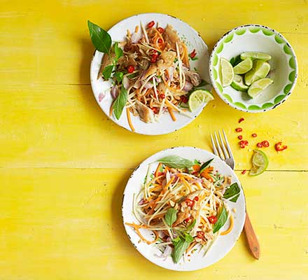 Spicy green mango salad with smoked fish