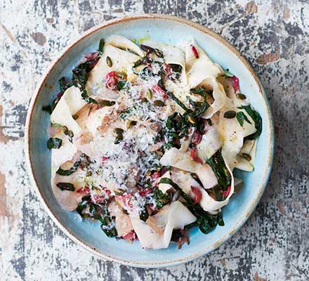 Celeriac ribbons tossed with chard, garlic & pumpkin seeds