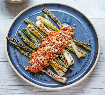 Charred spring onions & romesco