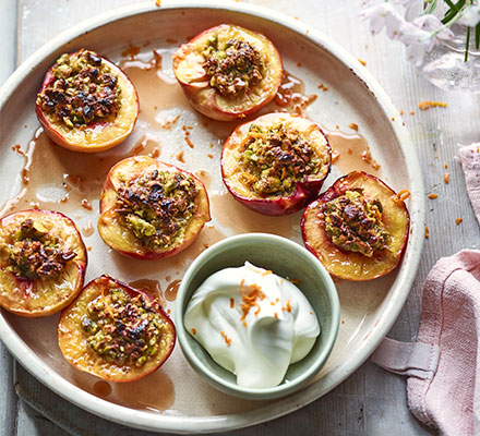 Roast pistachio-stuffed peaches with orange blossom cream