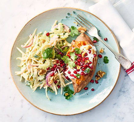 Sweet potato jackets with pomegranate & celeriac slaw