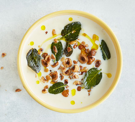 Cauliflower cheese soup with crispy sage & hazelnuts