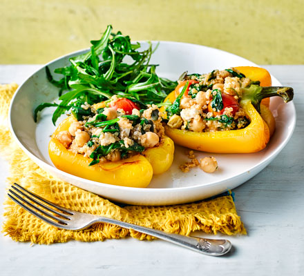 Quinoa-stuffed peppers with roast tomatoes & feta