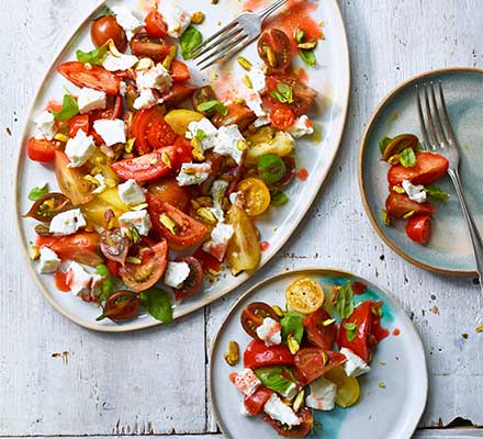 Tomato, goat’s curd & basil salad with raspberry vinegar dressing