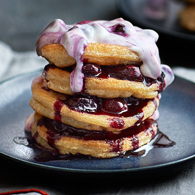 Fluffy almond pancakes with blueberry ripple yogurt