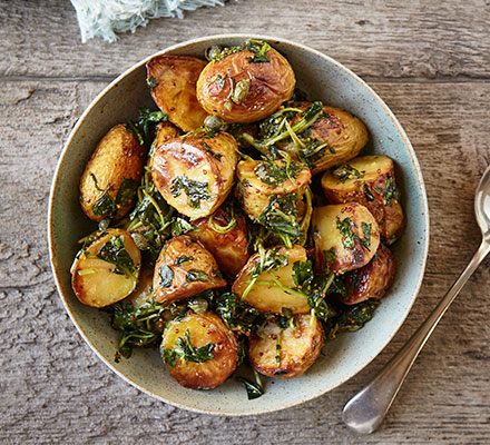 Baked new potatoes with wilted wild garlic