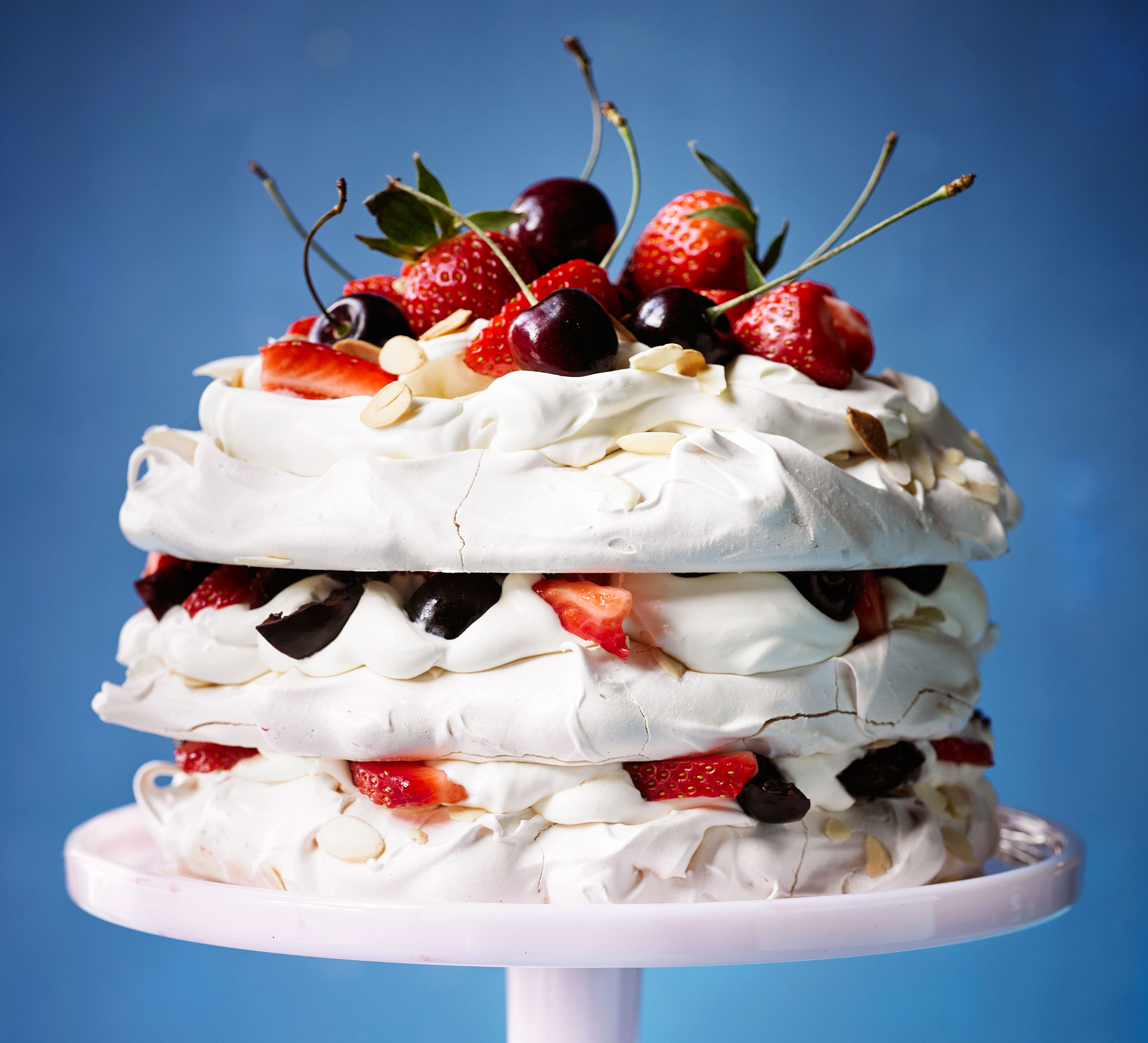 Amaretto meringue cake with strawberries & cherries