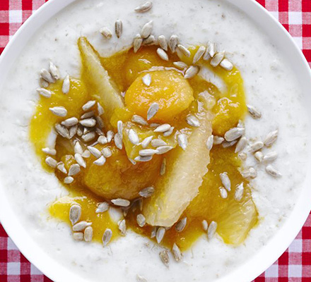 Creamy yogurt porridge with apricot, ginger & grapefruit topping