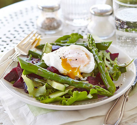 Asparagus salad with a runny poached egg