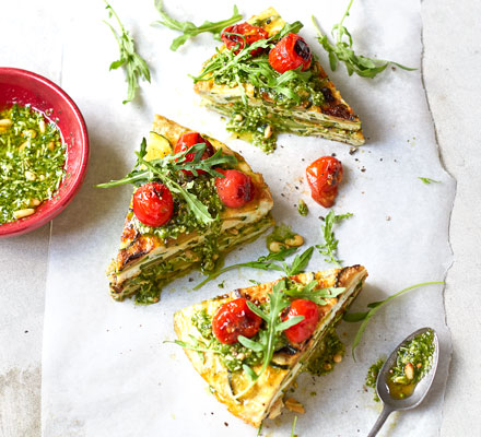Courgette tortilla wedges with pesto & rocket