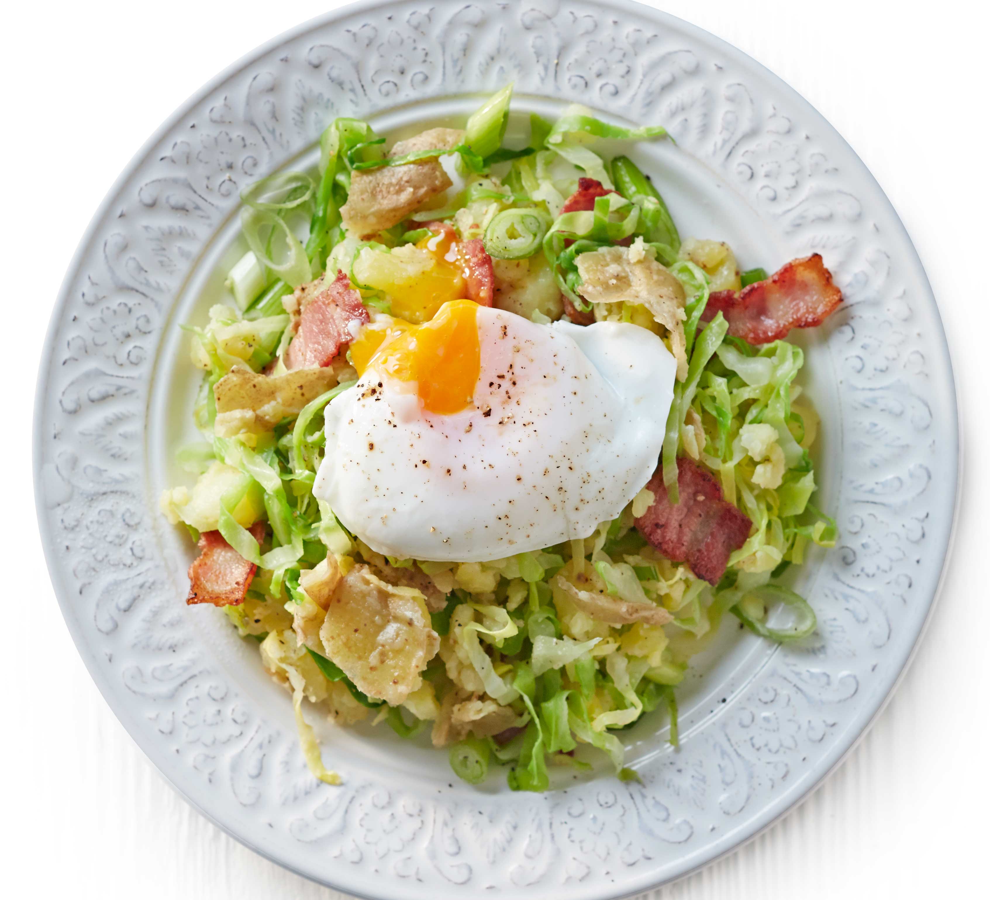 Crushed potato colcannon with bacon & poached eggs