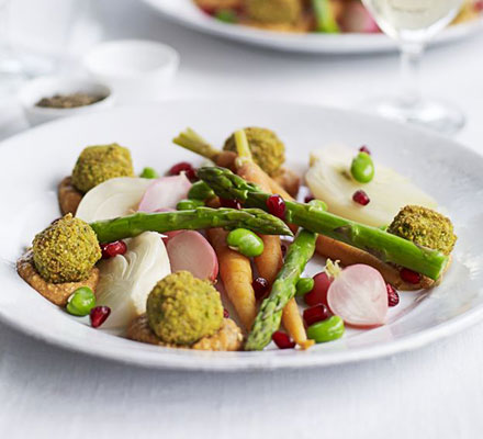 Falafels with spicy tomato & cashew sauce & poached spring vegetables