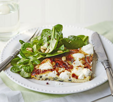 Slice of frittata with nutty green salad & balsamic dressing