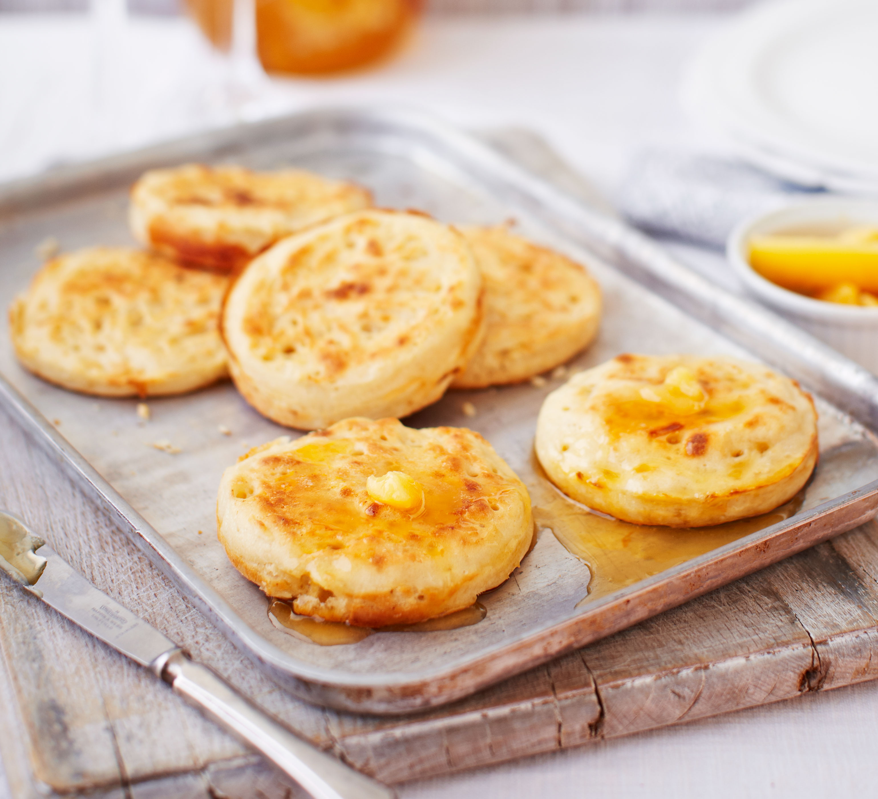 Homemade crumpets with burnt honey butter