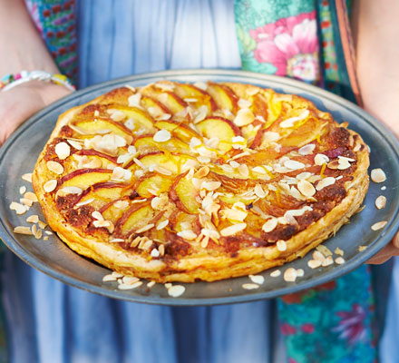 Peach puff pastry tart with almonds