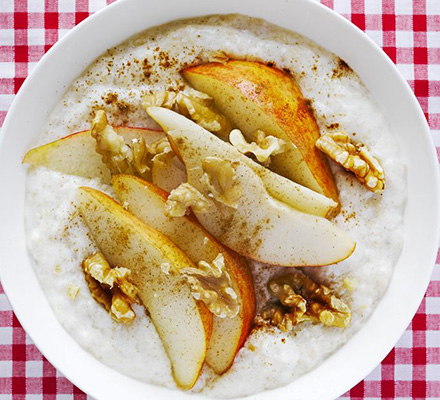 Creamy yogurt porridge with pear, walnut & cinnamon topping