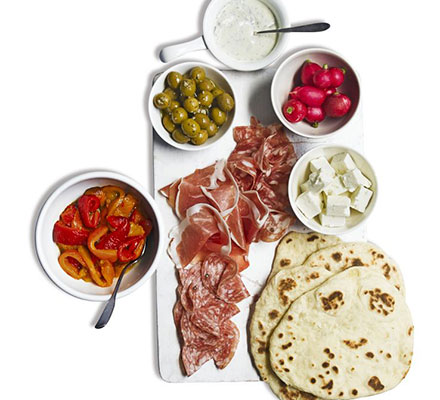 Antipasti platter with homemade flatbreads