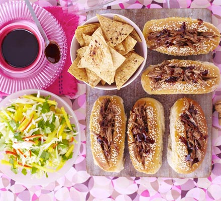 Sticky duck-dogs with chopped mango slaw & Chinese crisps