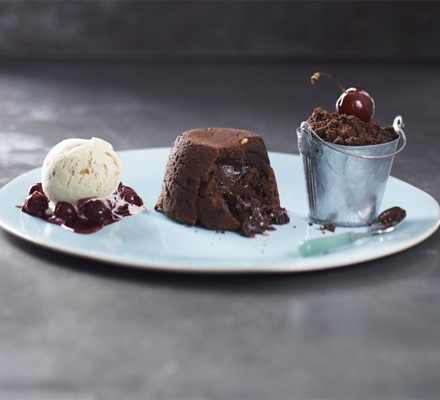 Choc-peanut fondants with chocolate soil & cherries