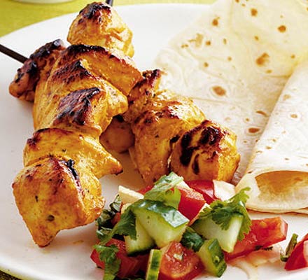 Chicken tikka kebabs with Indian salad