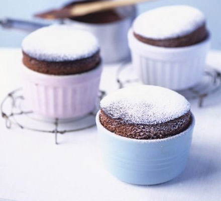 Hot chocolate soufflés with chocolate cream sauce