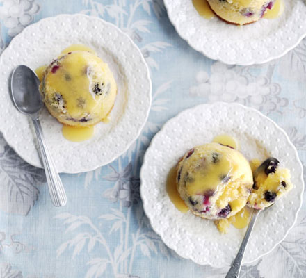 Little blueberry puddings with lemon curd sauce