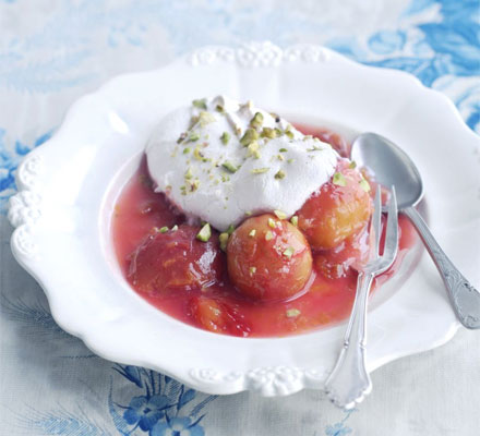 Syrupy plums with pistachio meringues