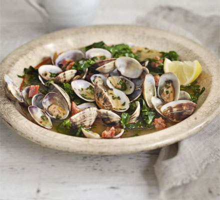 Steamed clams in saffron & spring green broth