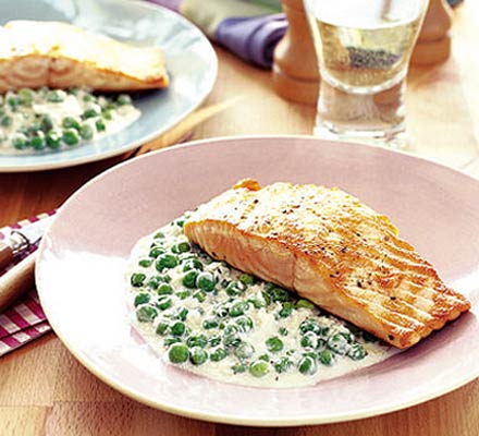 Stir fry of green peas with grilled salmon