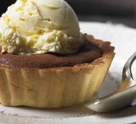 Warm choc-orange tarts with orange ice cream