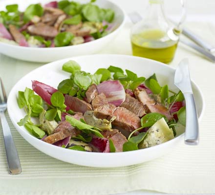 Lamb steaks with artichoke salad