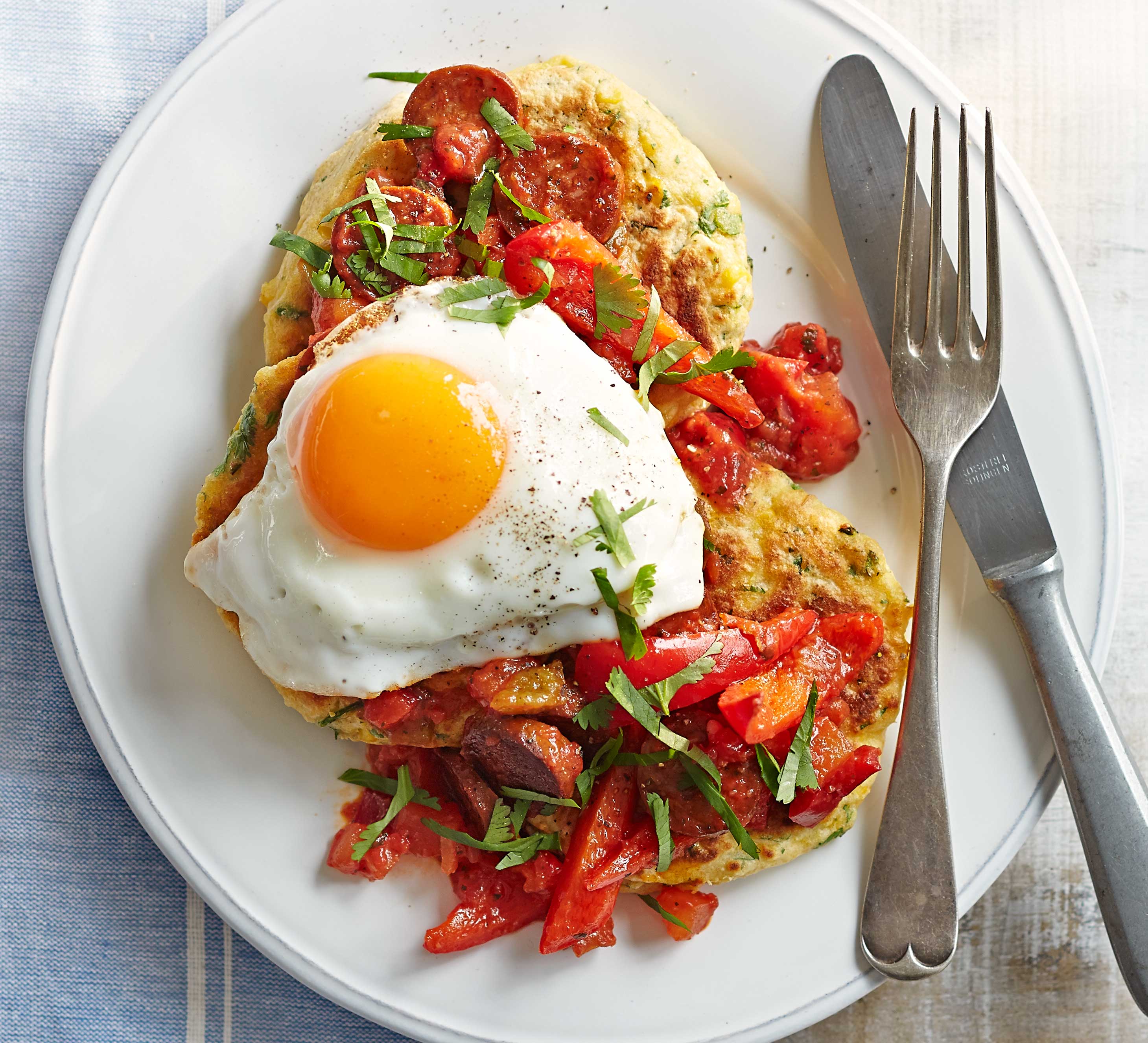 Sweetcorn pancakes with fried eggs & chorizo salsa