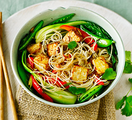 Asian tofu with stir-fried noodles, pak choi & sugar snap peas