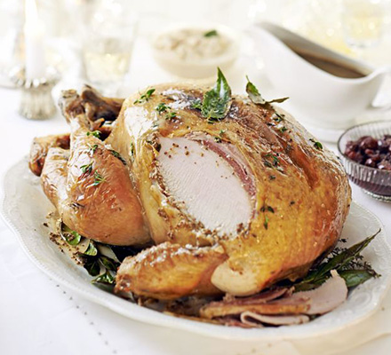 Mustard butter-basted roast turkey with bacon