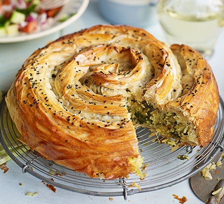 Veggie spiral pie with spiced tomato sauce & chopped salad