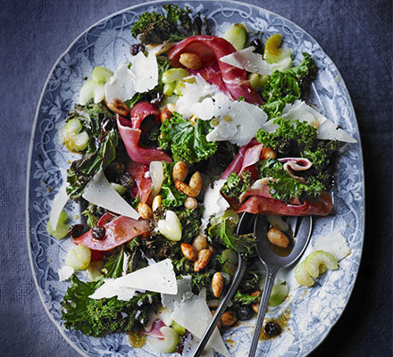 Warm kale salad with almonds & Serrano ham