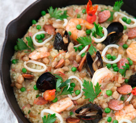 Paella with seafood, chicken and chorizo