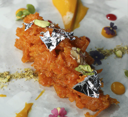 Gajar Ka Halwa  (Carrot pudding with toasted nuts and carrot ginger sauce)