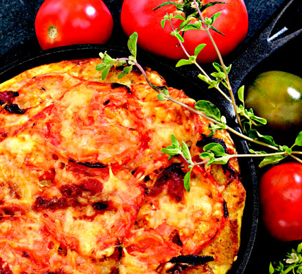 Italian strata with tomatoes, bell pepper, and Swiss cheese