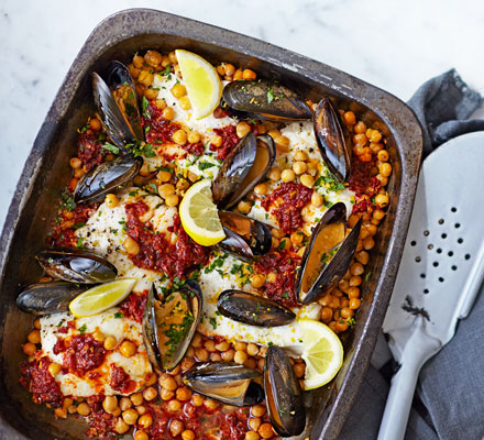 Nduja-baked hake with chickpeas, mussels & gremolata