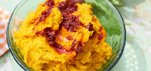 Carrot & cumin hummus with swirled harissa
