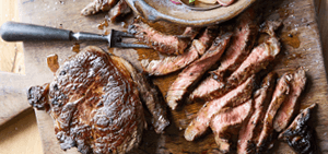 Rib-eye with steak pan potatoes & peas