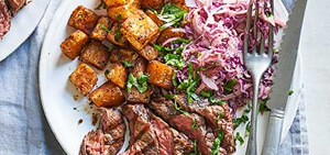 Smoky steak with Cajun potatoes & spicy slaw