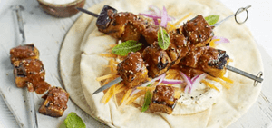Harissa aubergine kebabs with minty carrot salad